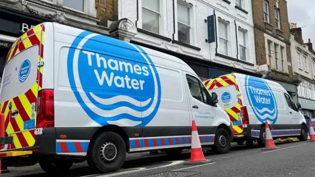 Thames Water vans parked behind traffic cones