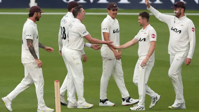 Surrey celebrate taking wicket