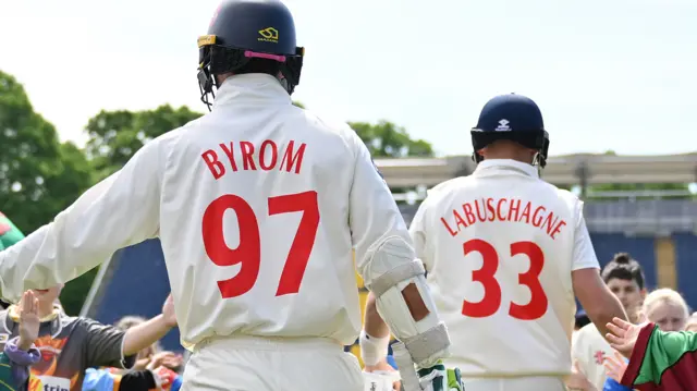 Eddie Byrom and Marnus Labuschagne walk out