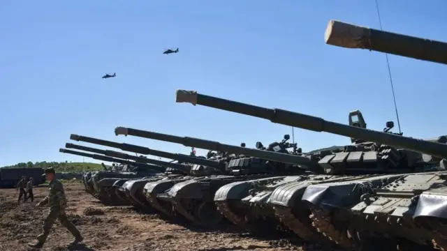 A handout photo made available by the press service of the Russian Defence Ministry on 06 September 2022 shows tanks and servicemen taking part in the Vostok 2022 strategic command and staff exercise