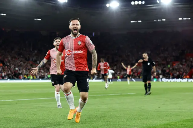 Adam Armstrong celebrates