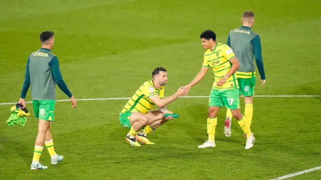 A disappointed Shane Duffy shakes hands with Norwich City team-mate Gabriel Sara after their play-off defeat at Leeds