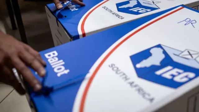 A picture of a blue and white ballot box