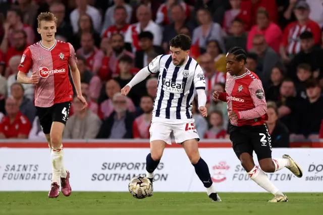 West Bromwich Albion's Mikey Johnston and Southampton's Kyle Walker-Peters (right) battle for the ball