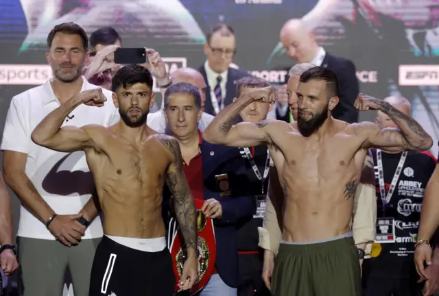 Joe Cordina and Anthony Cacace pose for pictures at a weigh-in