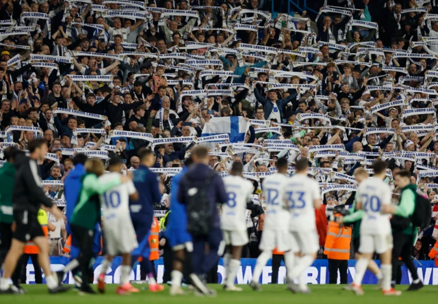 Leeds players and fans celebrate after their play-off win over Norwich