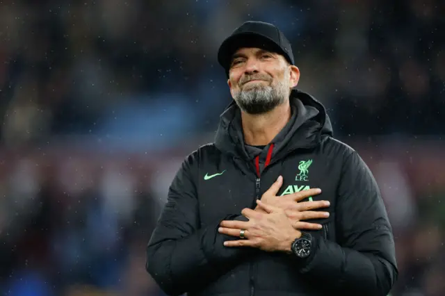 Liverpool boss Jurgen Klopp with his hand on his chest in appreciation