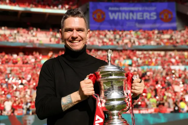 Manager Marc Skinner with the Women's FA Cup after Manchester United beat Tottenham in the 2024 final