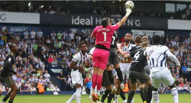 Southampton goalkeeper Alex McCarthy punches a cross clear