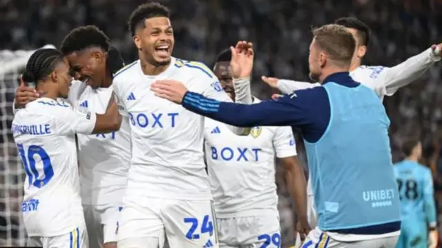 Leeds players celebrate a goal against Norwich