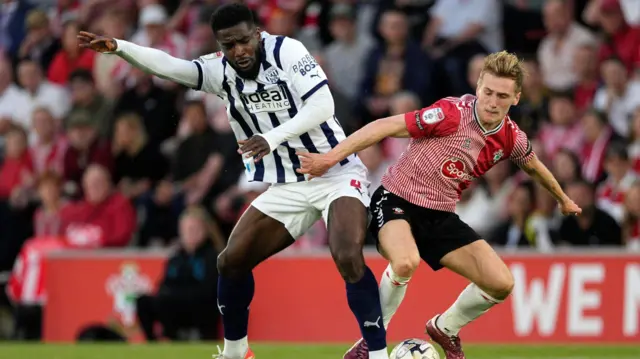 Cedric Kipre of West Bromwich Albion battles with Flynn Downes of Southampton