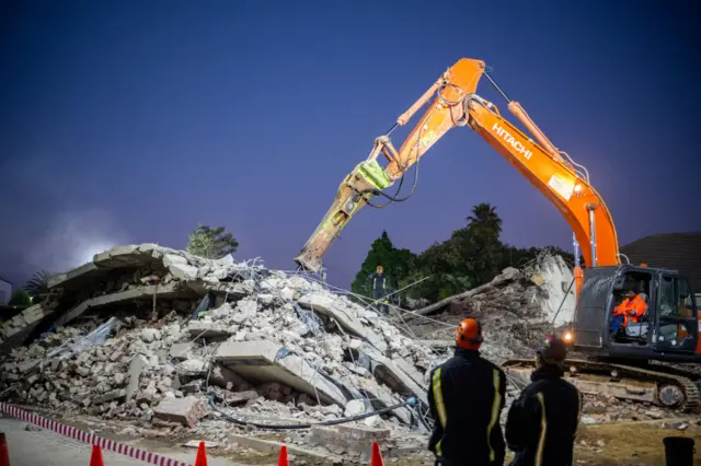 A hammer drill is used during search and rescue operations on Day 04 at the Neo Victoria apartment building in Victoria Street on May 09, 2024 in George, South Africa.