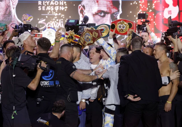 Tyson Fury and Oleksandr Usyk are separated by security