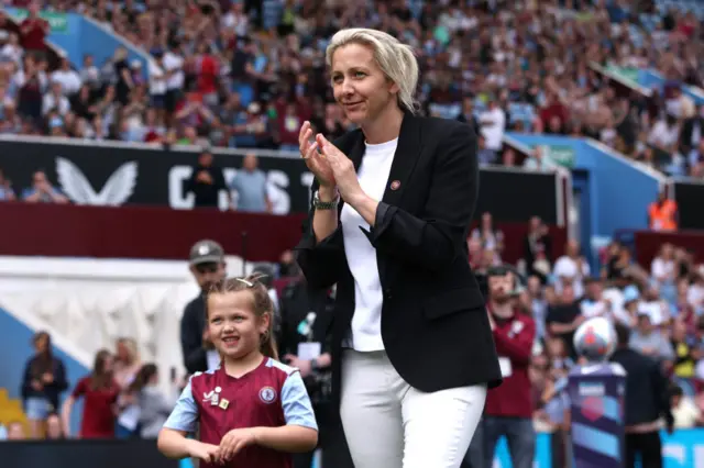 Carla Ward, Manager of Aston Villa, applauds the fans as she walks onto the pitch prior to the Barclays Women´s Super League match between Aston Villa and Manchester City