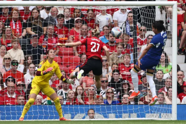 Chelsea's Colombian striker #35 Mayra Ramirez (R) heads home the opening goal during the English Women's Super League football match between Manchester United and Chelsea at Old Trafford