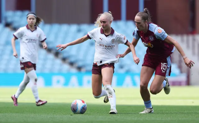 Laura Blindkilde of Manchester City is challenged by Lucy Parker of Aston Villa during the Barclays Women´s Super League match between Aston Villa and Manchester City at Villa Park