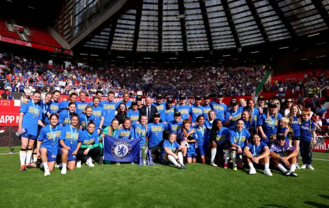 The players and coaching staff of Chelsea pose for a photo at full-time after winning the Barclays Women's Super League title following the Barclays Women´s Super League match between Manchester United and Chelsea FC