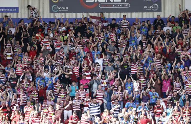 Wigan fans celebrate their win over Hull KR