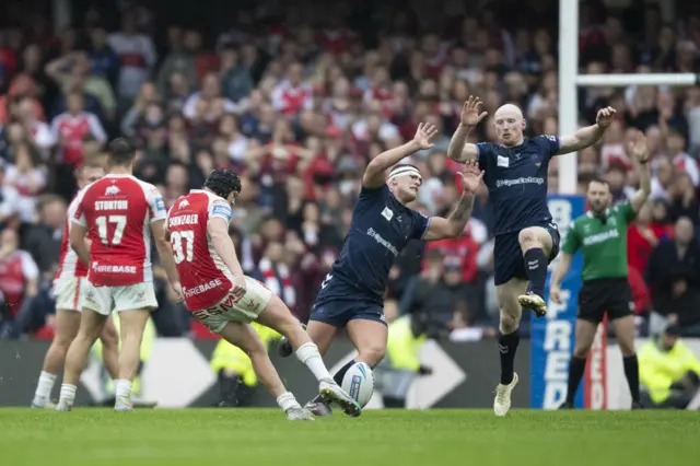 Brad Schneider of Hull KR kicks a drop goal in extra time to beat Wigan in the 2023 Challenge Cup semi-final