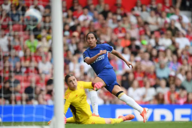 Mayra Ramirez of Chelsea scores her team's fourth goal past Mary Earps of Manchester United during the Barclays Women´s Super League match between Manchester United and Chelsea FC