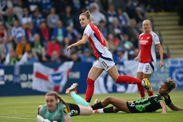 Vivianne Miedema (C) celebrates after scoring their third goal during the English Women's Super League football match between Arsenal and Brighton and Hove Albion at Meadow Park