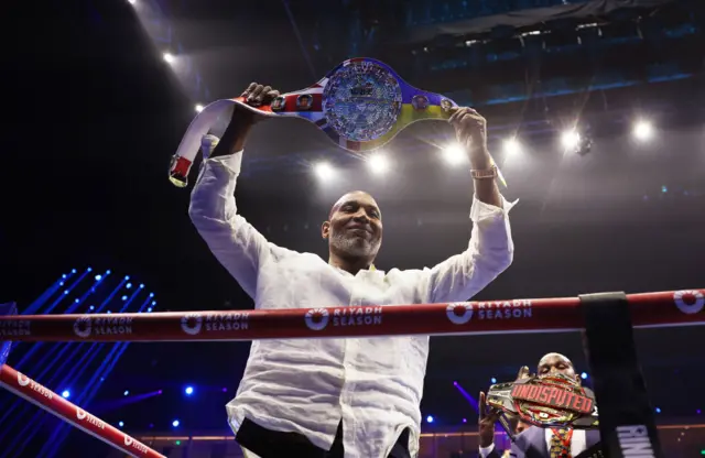 Lennox Lewis with the WBC world title