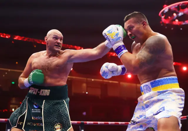 Tyson Fury jabs Oleksandr Usyk