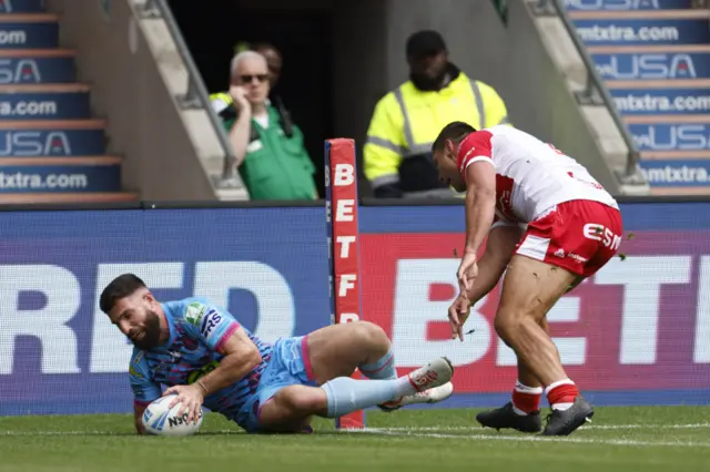 Abbas Miski scores Wigan's second try