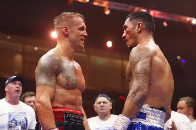 A bloodied Jai Opetaia and Mairis Briedis in the ring after their fight