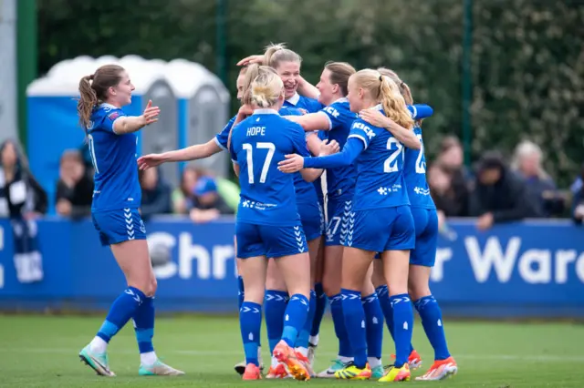 Everton players celebrate a goal against Tottenham in the WSL