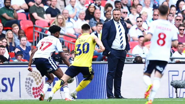 Bolton boss Ian Evatt watches his side against Oxford