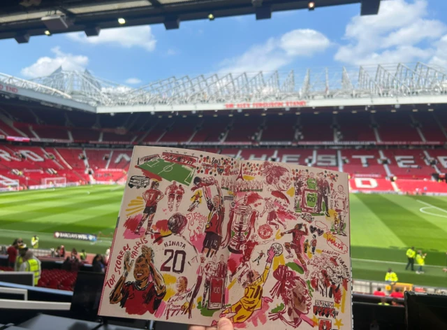 match programme with Old Trafford in the background