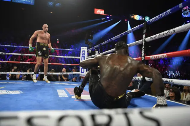 Deontay Wilder is knocked to the floor by Tyson Fury