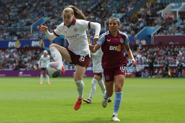 Manchester City's English midfielder #16 Jess Park (L) vies with Aston Villa's french midfielder #10 Kenza Dali (R) during the English Women's Super League football match between Aston Villa and Manchester City