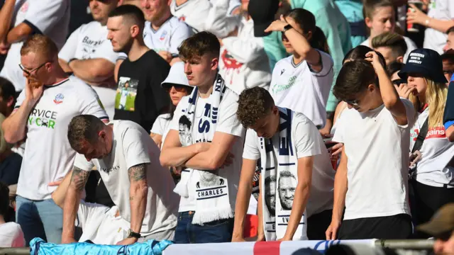 Dejected Bolton fans