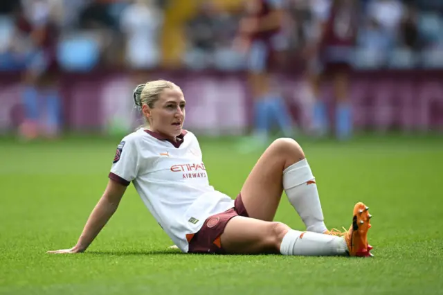 Laura Coombs of Manchester City looks on as she sits on the floor after picking up an injury during the Barclays Women´s Super League match between Aston Villa and Manchester City