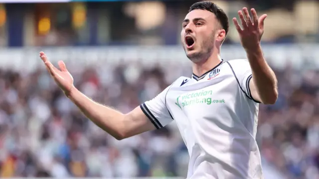 Bolton forward Aaron Collins celebrates a goal against Barnsley