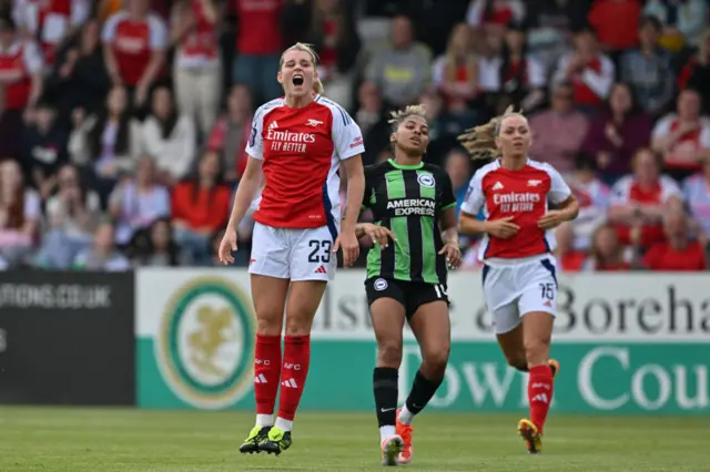 Alessia Russo (L) reacts to a missed chance during the English Women's Super League football match between Arsenal and Brighton and Hove Albion at Meadow Park