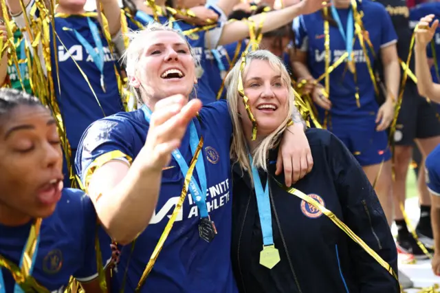 Millie Bright and Emma Hayes, Manager of Chelsea, celebrate with their medals after the team's victory in the Barclays Women´s Super League match between Manchester United and Chelsea FC