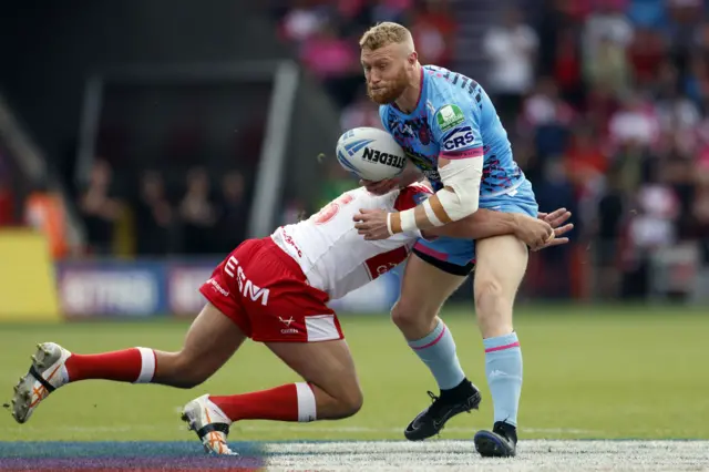 Wigan's Luke Thompson is tackled