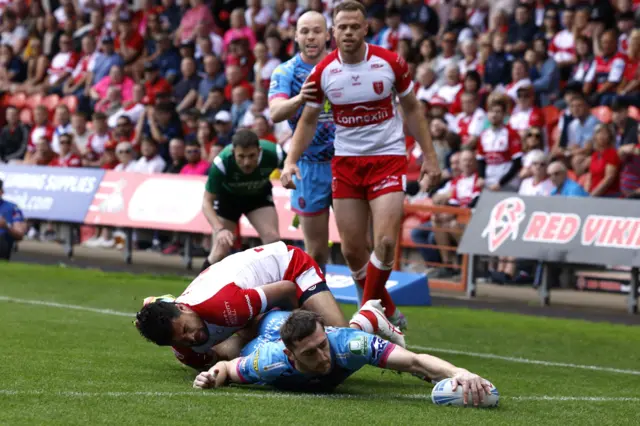 Jake Wardle scores Wigan's first try against Hull KR