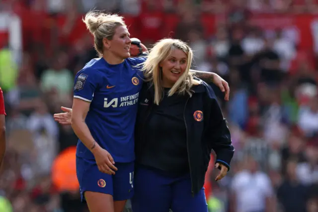 Chelsea's English manager Emma Hayes (R) and Chelsea's English defender #04 Millie Bright (L) react to their win on the pitch after the English Women's Super League football match between Manchester United and Chelsea at Old Trafford