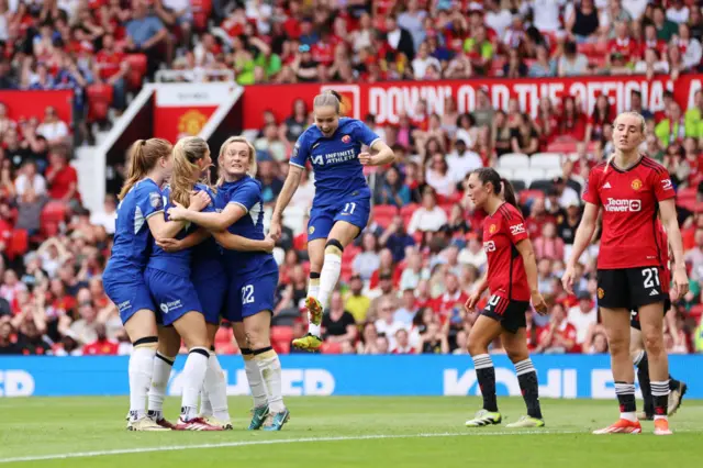 Melanie Leupolz of Chelsea celebrates with teammates after scoring her team's fifth goal during the Barclays Women´s Super League match between Manchester United and Chelsea FC