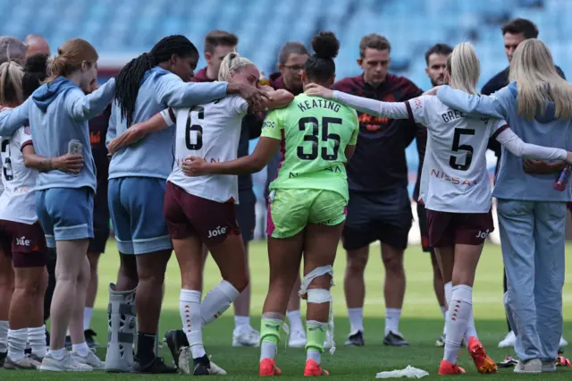 Manchester City's English defender #06 Steph Houghton (C) reacts as City players frm a group huddle on the pitch after the English Women's Super League football match between Aston Villa and Manchester City