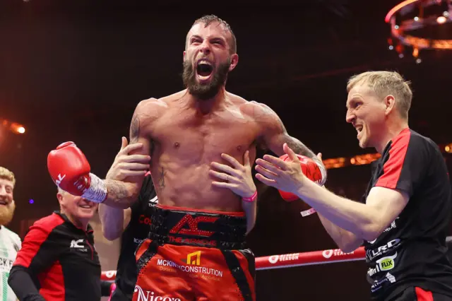 Anthony Cacace celebrates as the referee steps in to stop the fight