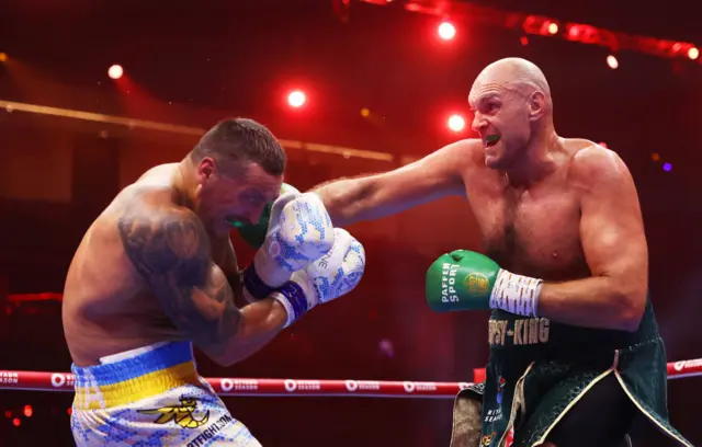 Tyson Fury lands a right hand on Oleksandr Usyk