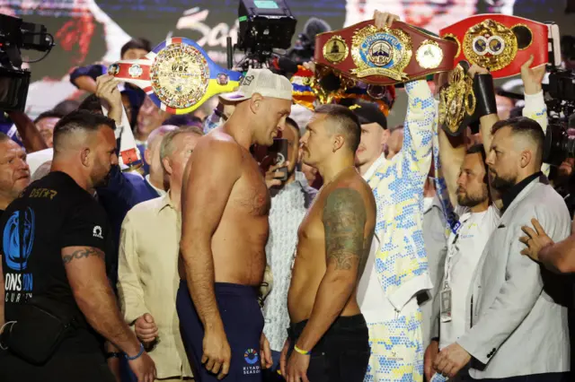 Tyson Fury and Oleksandr Usyk stand face-to-face