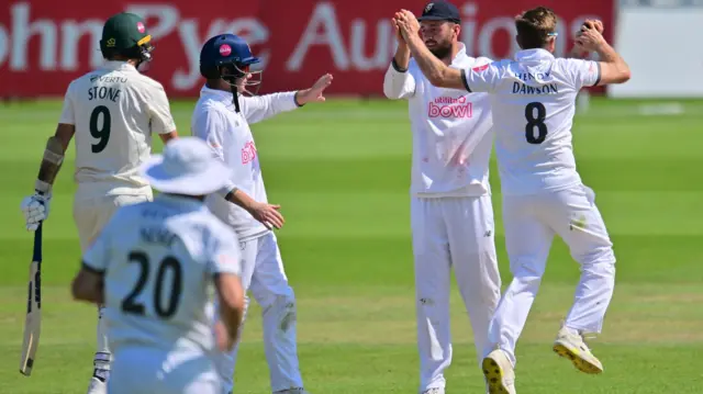 Liam Dawson celebrates taking wicket