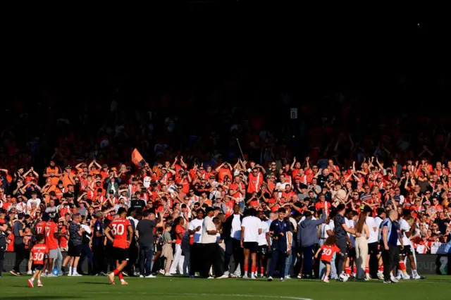 Luton Town players applaud fans following the Premier League match between Luton Town and Fulham FC at Kenilworth Road