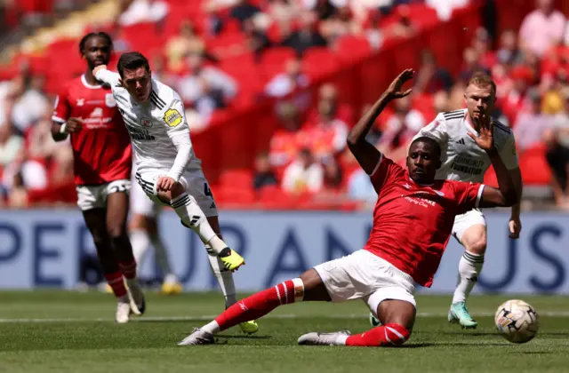 Crawley's Liam Kelly shoots at goal